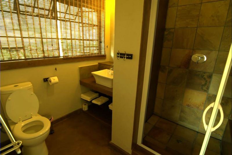 second bathroom with luxurios shower with seat